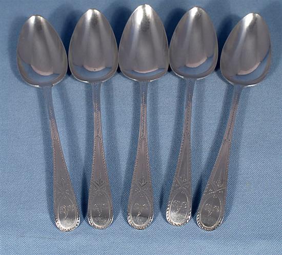 A set of five George III silver bright cut table spoons, Length: 8 ¼”/211mm Total Weight 7.3oz/207grms